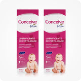 For Conceive Plus Fertility Lubricant Tube + Applicators (PT), two 75ml fertility lubricant tube retail boxes in Portuguese, each featuring a baby image, mineral icons for calcium and magnesium, and pH balance highlights, presented side by side against white background to showcase bundle packaging.