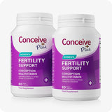 Two bottles of Conceive Plus Women's Fertility Support supplement, each labeled with purple and white branding and containing 60 pink vegan capsules. Promoted as a conception multivitamin for women trying to conceive. Designed to support fertility, hormonal balance, and reproductive health.