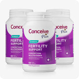 Three bottles of Conceive Plus Women's Fertility Support supplement, each featuring purple and white labeling. Contains 60 pink vegan capsules per bottle. Marketed as a conception multivitamin to aid women in supporting fertility and reproductive wellness.